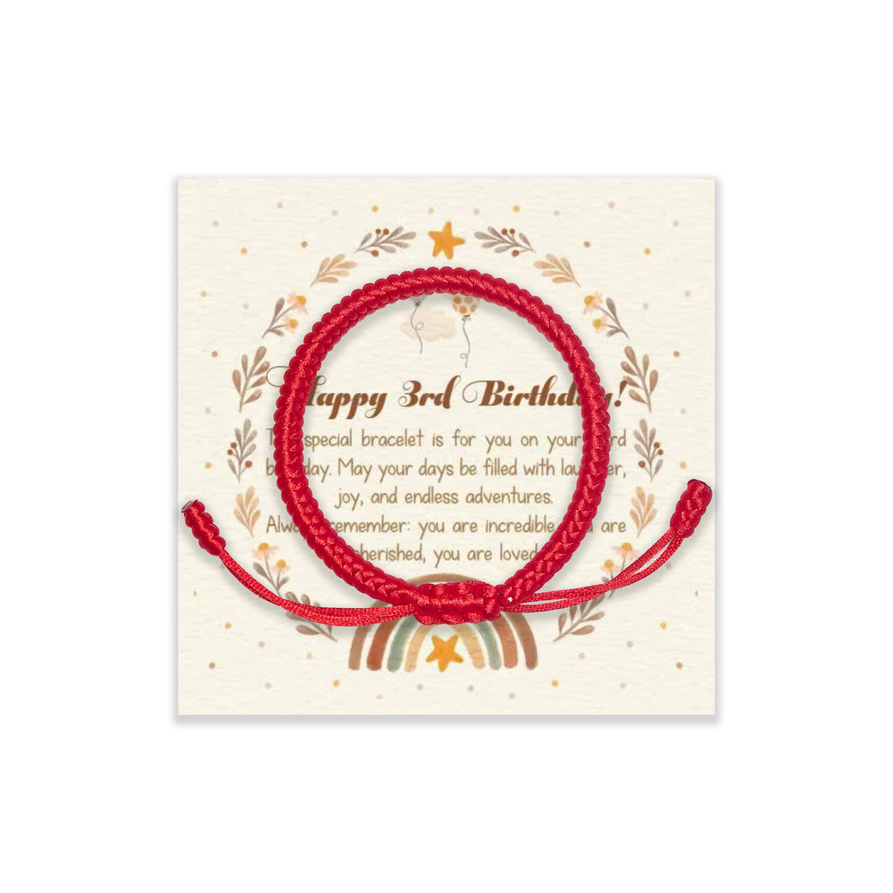 Shop300 adjustable red string bracelet on a child's wrist, comfortable all-day wear.