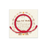 Shop300 adjustable red string bracelet on a child's wrist, comfortable all-day wear.