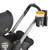 Shopperals cup and phone holder on a Doona stroller keeps drinks and phone within reach.