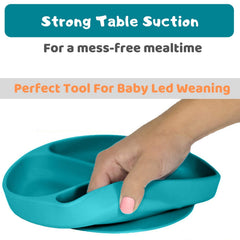 Silikong suction plate used during baby-led weaning encourages independent self-feeding.
