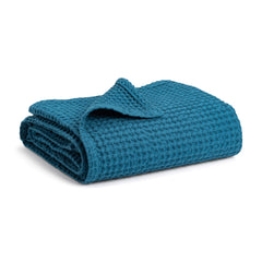 Simka Rose waffle baby blanket folded, showing soft cotton texture for cozy warmth.