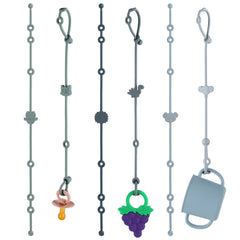 Slotic 6-pack baby toy straps keeping pacifiers secure during stroller outings.