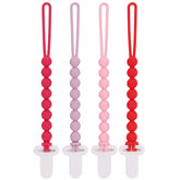 Slotic pacifier clip pink one-piece beads closeup demonstrates safer design for newborns.