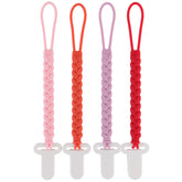 Slotic pacifier clip with woven rope in pink securely attaches to baby clothing.