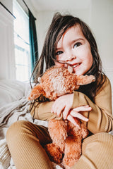Slumberkins Yak Snuggler in a child-reading moment supports emotional learning