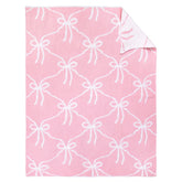 SmoothNovelty Pink Bow Knit Swaddle Blanket front view, cozy cotton comfort for year-round use