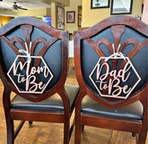 Snlioek mom-to-be chair sign front view marks the honored seat for guests.