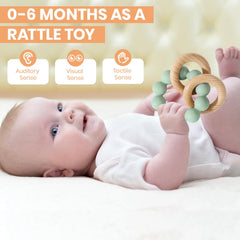 Socub Cambridge Blue teether ring with beech wood highlights tactile stimulation and safe chewing.