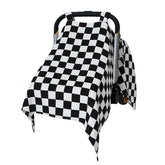 solTourne muslin car seat cover in black and white plaid provides 360° shade for baby.