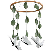 Sorrel + Fern baby crib mobile with wooden butterflies adds calming nursery decor
