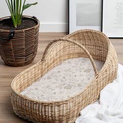 Sorrel + Fern folded bassinet sheets reveal buttery-soft cotton blend and quality.