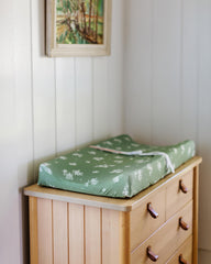 Butterfly Garden fitted cover on changing pad highlights deep pockets and snug fit.