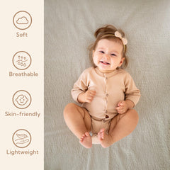 SOULFUL crib sheets elastic fit close-up shows secure flat fit on standard 28x52 mattress.
