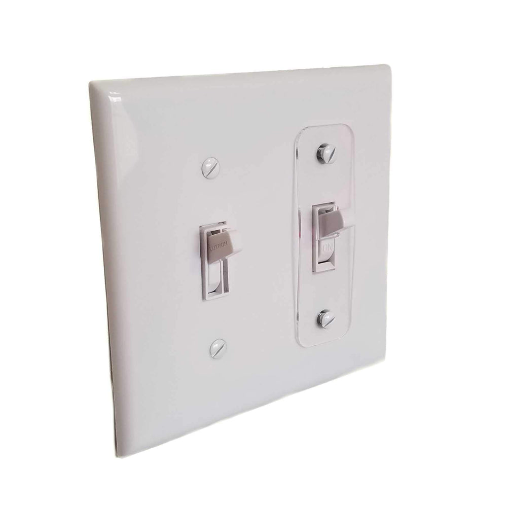SpeedFreakCNC toggle switch plate lock in clear installed on faceplate prevents accidental operation.