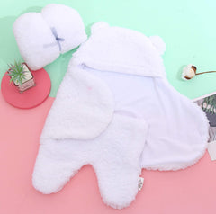 Spotted Play sherpa swaddle blanket pink-white wrapped baby demonstrates secure snug swaddle