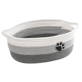 STOBS K small woven basket with handle keeps clutter organized on shelves.