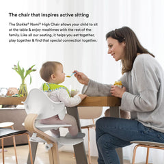 Stokke Nomi walnut stem design adds natural warmth and durability.