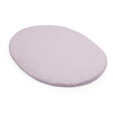 Stokke Sleepi Mini fitted sheet V3 Lavender on mattress offers soft cotton percale comfort for newborns.