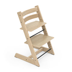 Stokke Tripp Trapp oak natural, forward view at table for inclusive family meals.