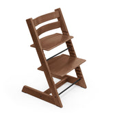 Stokke Tripp Trapp chair warm brown front view highlighting adjustable seat for growing families.