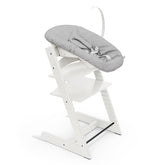 Stokke Tripp Trapp chair white side view shows growing-child usability for mealtime.