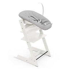 Stokke Tripp Trapp chair white side view shows growing-child usability for mealtime.