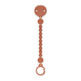 Suavinex Color Essence pacifier clip in sunset orange secures the pacifier for mess-free outings.