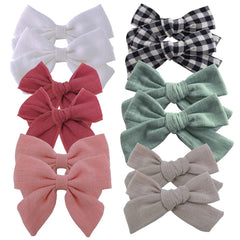 Sugarmelon 12-piece linen bow with alligator clip set keeps outfits cohesive for baby girls