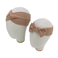 Sugarmelon baby headband mauve close-up shows gentle fit for newborns.