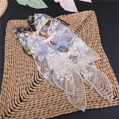 Sugarmelon fable bow closeup showing tulle texture for stylish detail