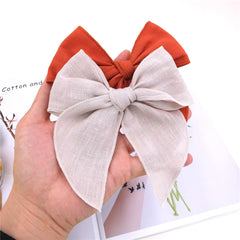 Sugarmelon Fable Bow Rust closeup linen texture