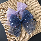 Sugarmelon large tulle bow clip in fresco navy foil adds elegant cottagecore flair.
