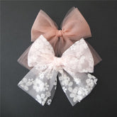 Sugarmelon large tulle bow pink floral on baby hair for daily outfits.
