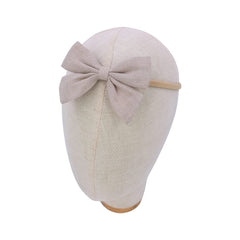 Sugarmelon linen bow headband ideal for newborn photoshoot.