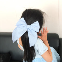 Sugarmelon linen-cotton-velvet fabric closeup blue-sky bow, emphasizing soft durable material.