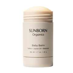 Sunborn Organics Baby Balm stick application for mess-free moisture.
