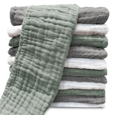 Sunny zzzZZ muslin burp cloth in white, folded for quick protection.