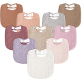 Susurration muslin baby drool bibs flatlay in plum color, showing soft textures for gentle everyday wear.