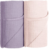 Susurration muslin swaddle blanket pink-purple folded for gentle newborn comfort and breathable wrapping.