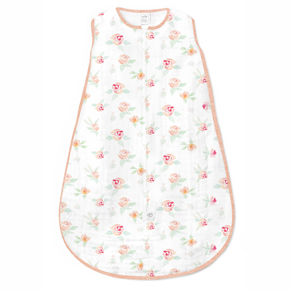 SwaddleDesigns sleep sack watercolor peachy pink floral shows breathable cotton for baby's calm naps.