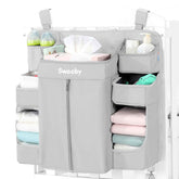 Sweeby diaper organizer on changing table closeup showing easy-access diaper pockets for quick changes