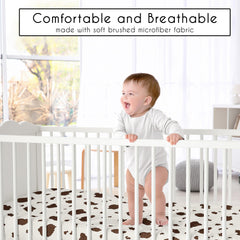 Sweet Jojo Designs cow print fitted crib sheet shown on a crib for snug fit.