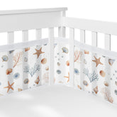 Sweet Jojo Designs Ocean Seashells long panel mesh crib liner keeps limbs inside for safety.