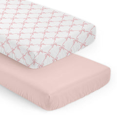 Sweet Jojo Designs pink bows crib sheet closeup, showcasing soft fabric and snug fit.