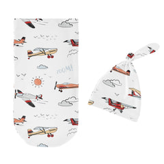 Sweet Jojo Designs top knot beanie on infant emphasises cozy head warmth