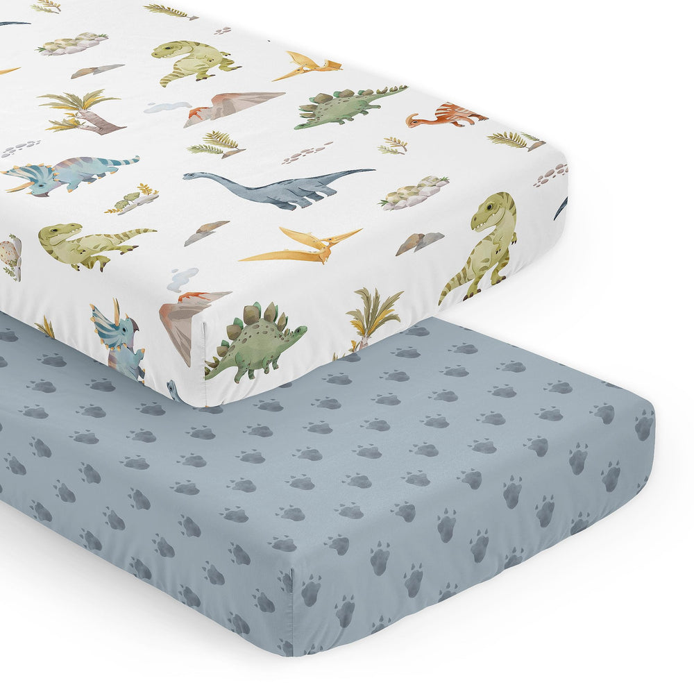 Sweet Jojo Designs watercolor dinosaur crib sheet in blue tracks for soft, breathable baby sleep.