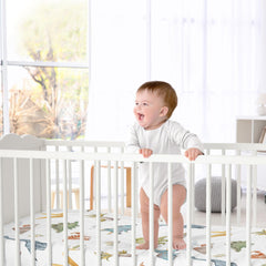 Sweet Jojo Designs watercolor dinosaur nursery colorway β coordinated look for gender-neutral decor.