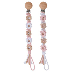 Symbolife daisy macrame clip closeup for secure pacifier on baby clothing