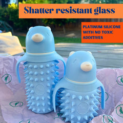 Tabor Place glass sippy with 8oz straw demonstrates leakproof design for easy sipping.