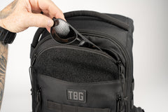 Tactical Baby Gear Daypack wipes pocket shows convenient on-the-go hygiene storage.